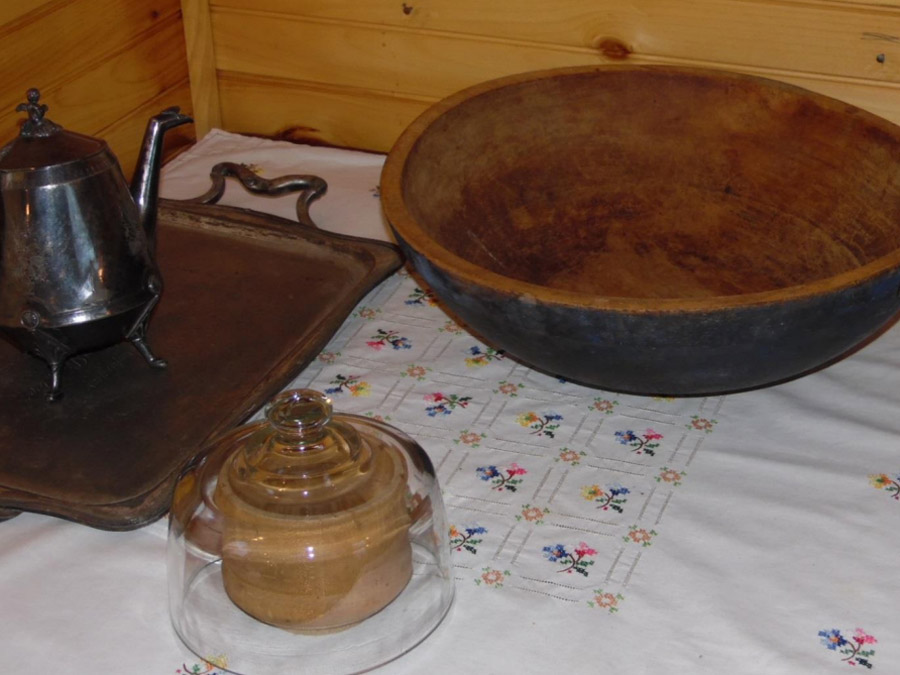 Carved butter press and wooden bowl